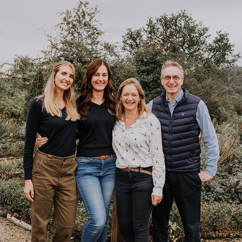 A team of four smiling