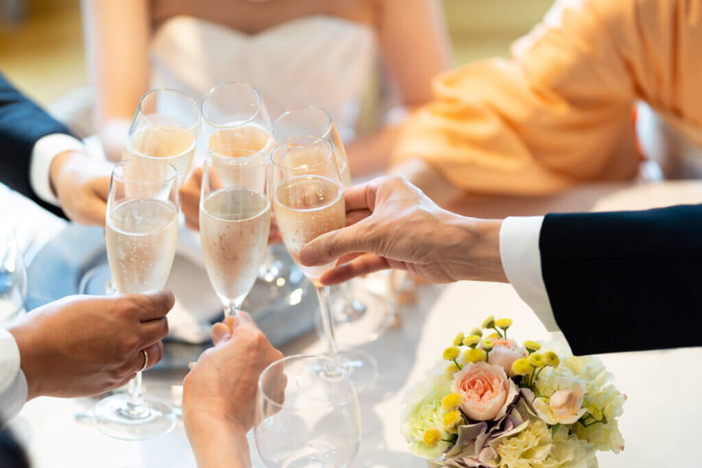Family clinking glasses at a wedding